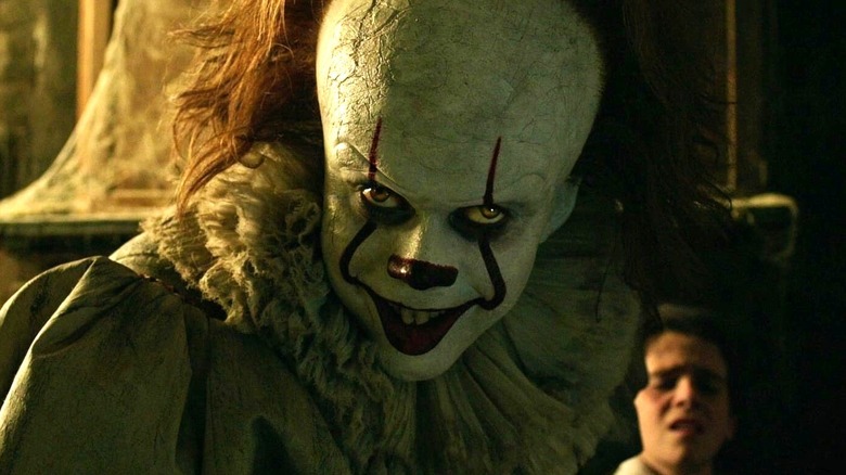 Pennywise smiling creepily in It (2017)