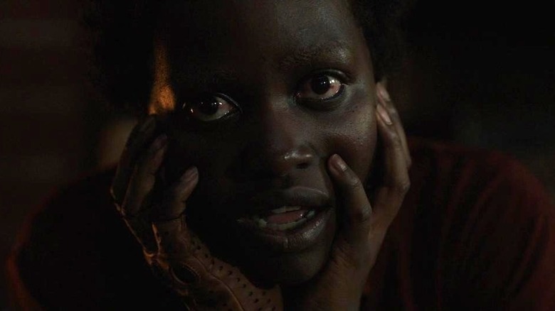 Red holding her face in Us (2019)