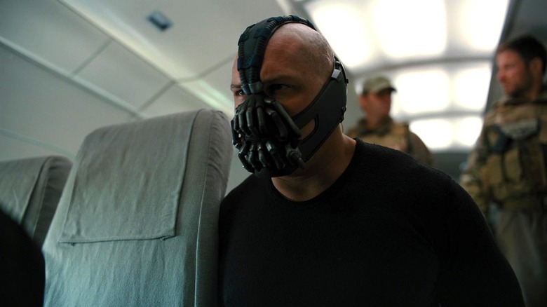 Bane being interrogated on a plane in The Dark Knight Rises (2012)