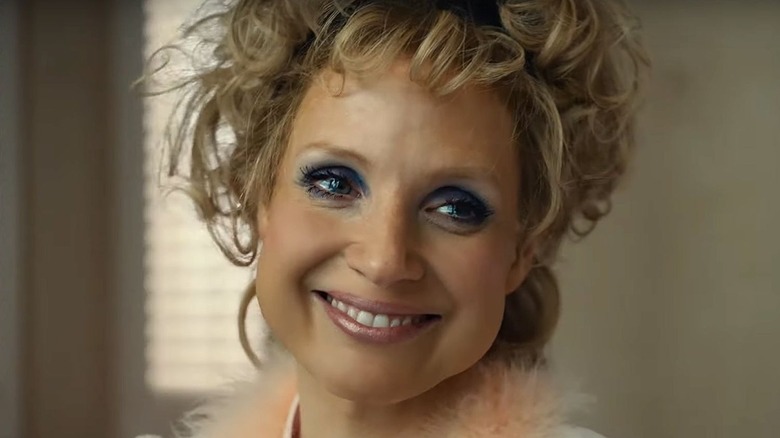 Tammy Faye smiling in "The Eyes of Tammy Faye."
