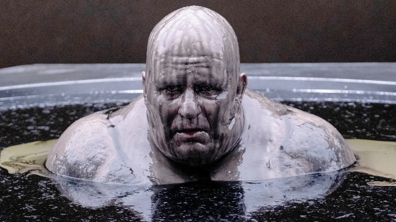Vladimir Harkonnen sitting in a tub in "Dune."