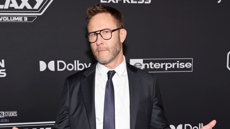 Michael Rosenbaum in a suit and tie