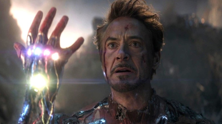 Robert Downey Jr.'s Iron Man holding the Infinity Gauntlet in Avengers: Endgame