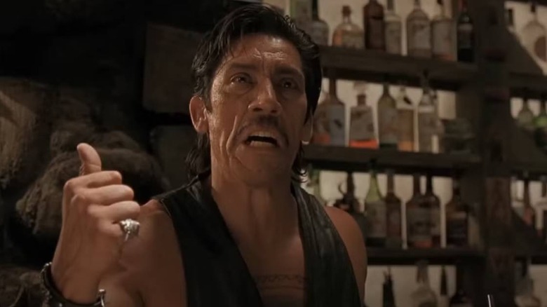 Razor Charlie pointing behind him in "From Dusk till Dawn"