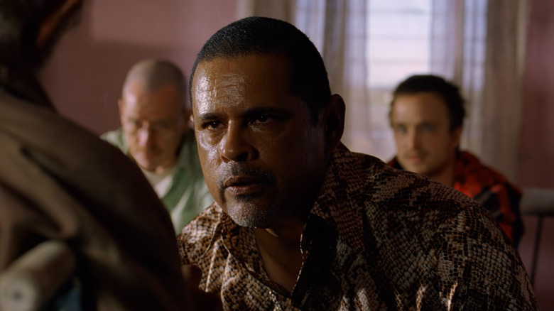 Tuco kneeling with Walter and Jesse behind him on "Breaking Bad"
