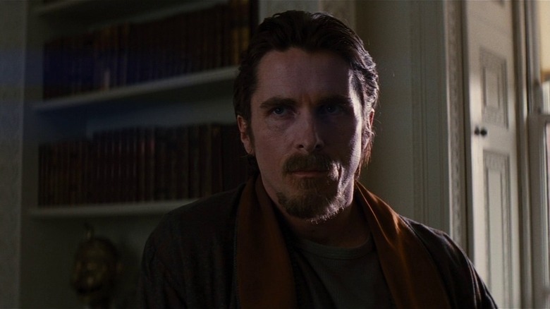 Bruce Wayne looking forlorn in The Dark Knight Rises (2012)