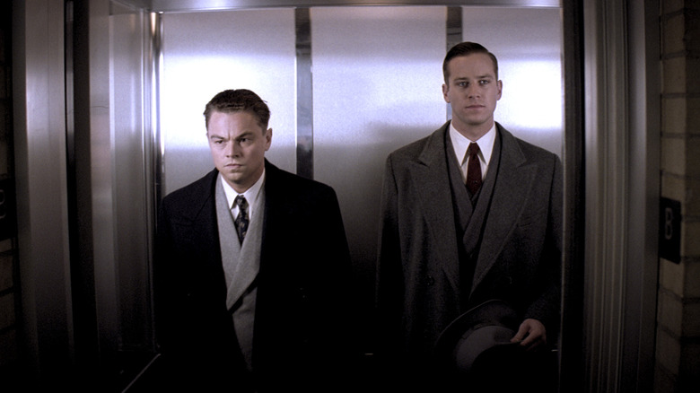 J. Edgar Hoover looking stern in an elevator in J. Edgar (2011)