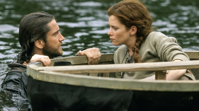 Andre Marek and Kate Ericson heading down the river in "Timeline" (2003)