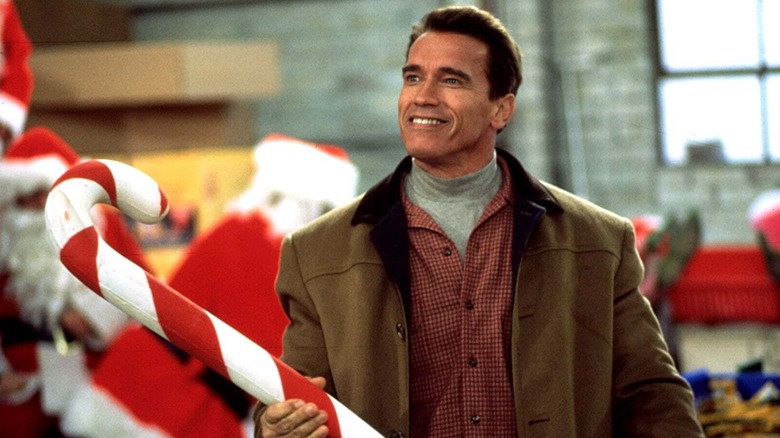 Howard holds a giant candy cane in "Jingle All the Way"