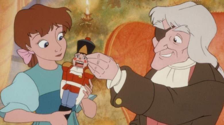 Drosselmeier and Clara marvel over her nutcracker in "The Nutcracker Prince" (1990)