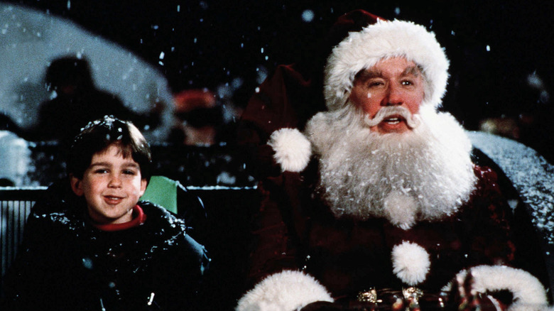 Scott and Charlie sitting in a sleigh in "The Santa Clause" (1994)