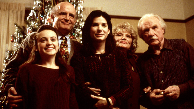 Lucy poses with the Callaghan family in "While You Were Sleeping"