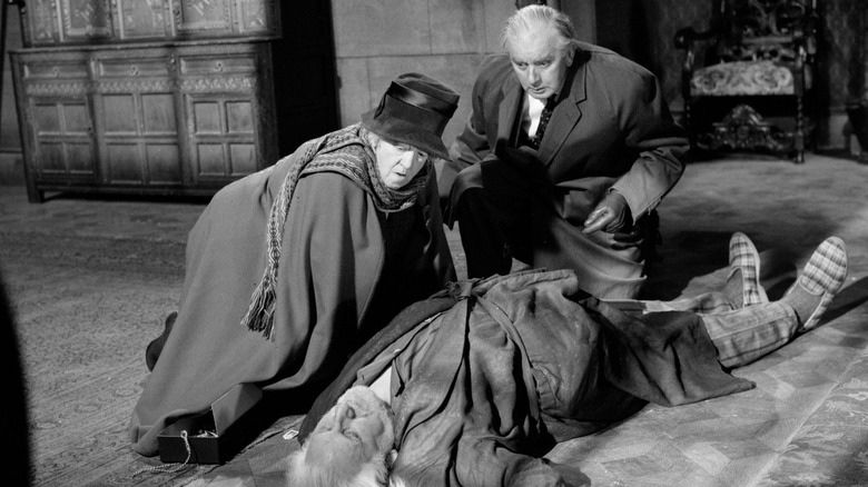 Marple and Stringer kneeling by a collapsed man in "Murder at the Gallop."