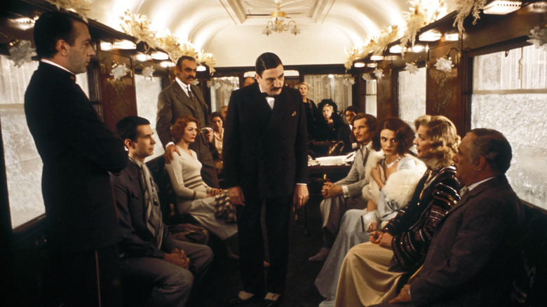 Hercule Poirot talking to the passengers in "Murder on the Orient Express."