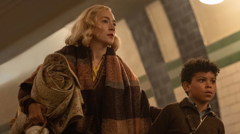 Rita and George heading for shelter in "Blitz"