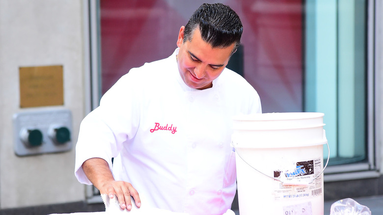 Buddy working some dough in Cake Boss (2009)