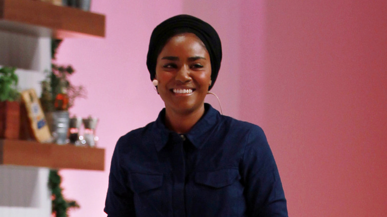 Nadiya Hussain smiling in a blue outfit