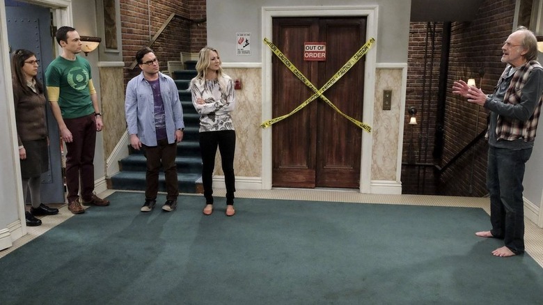 Theodore lecturing Penny, Amy, Sheldon, and Leonard next to the broken elevator in "the Big Bang Theory"