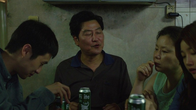 The Kim family eating in their tiny apartment in Parasite (2019)