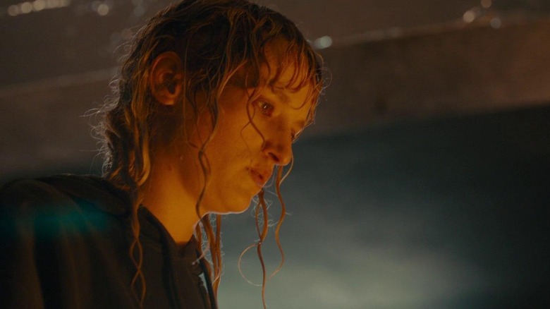 Alexia looking at the wreckage she's caused in Titane (2021)