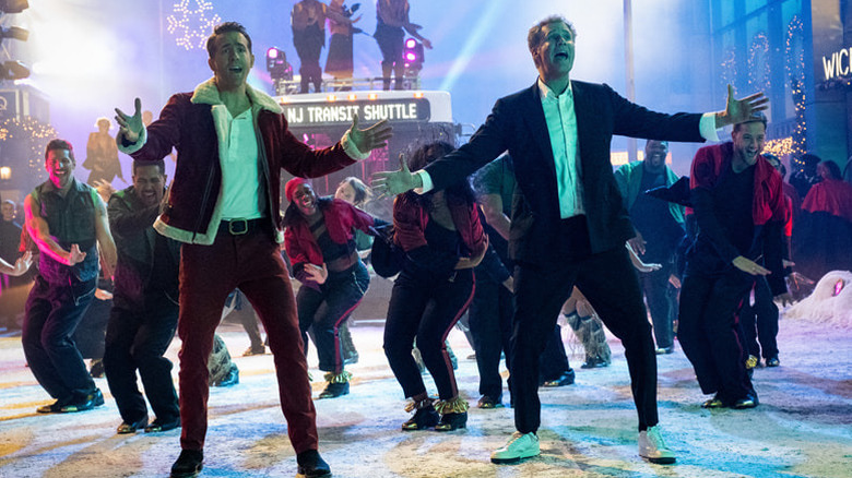 Clint and The Ghost of Christmas Present lead a musical number in "Spirited" (2022)