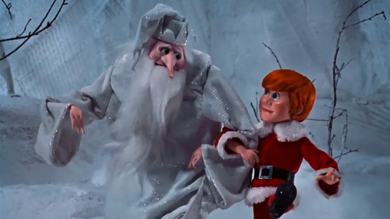 The Winter Warlock links arms with Kris Kringle in Santa Claus Is Comin' to Town (1970)