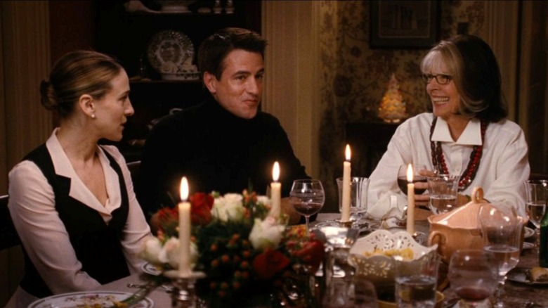 Meredith Morton, Everett Stone, and Sybil Stone sit at the dinner table in The Family Stone (2005)