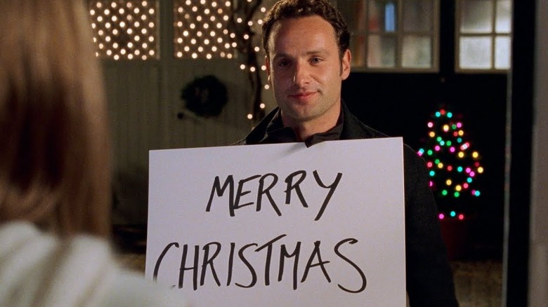 Mark holding a sign in Love Actually