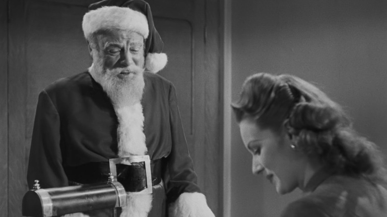 Santa speaking to a receptionist in Miracle on 34th Street