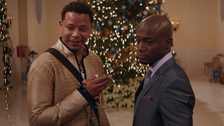 Harper and Quentin in front of a Christmas tree in The Best Man Holiday