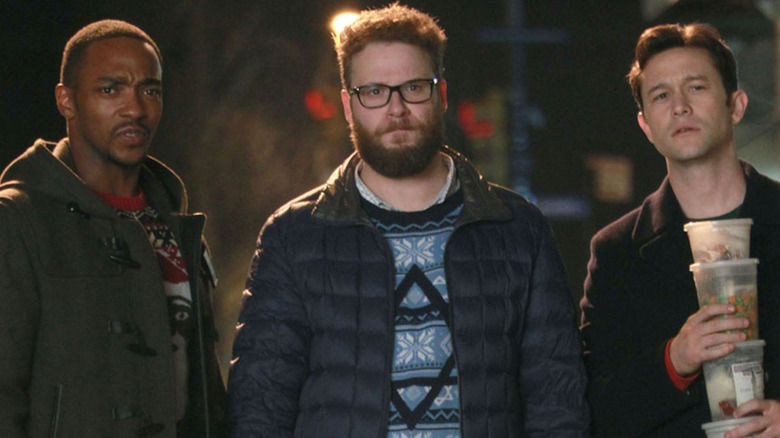 Ethan, Isaac, and Chris on the street at night in The Night Before