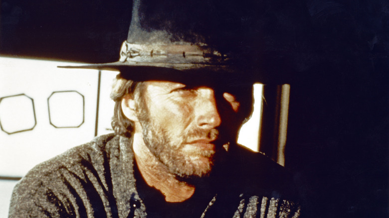 The Stranger sits in a saloon in "High Plains Drifter" (1973)