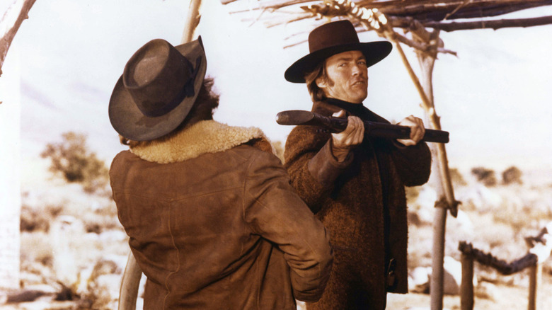 Joe hits someone with a rifle in "Joe Kidd" (1972)