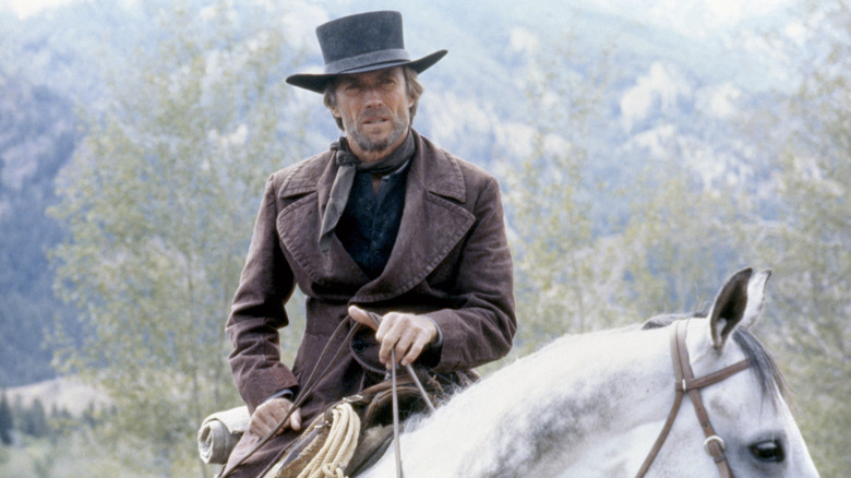 Preacher rides a horse in "Pale Rider" (1985)