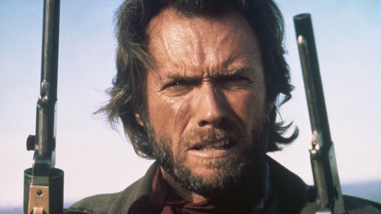 Josey Wales holds two pistols in "The Outlaw Josey Wales" (1976)