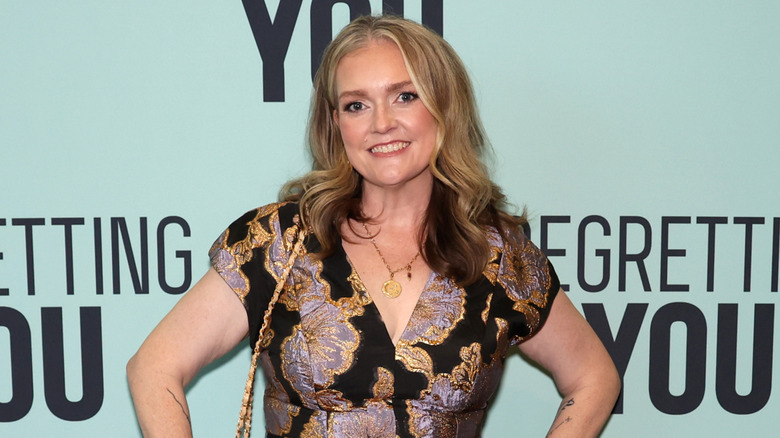 Colleen Hoover smiling at a fan screening of 