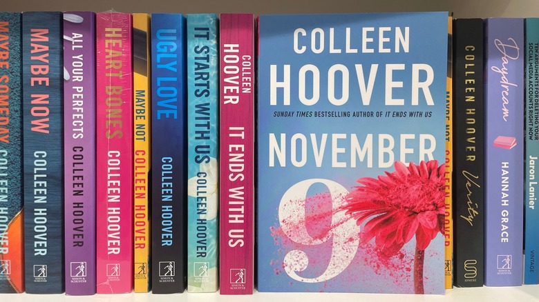 Colleen Hoover's "November 9" face out on a bookshelf