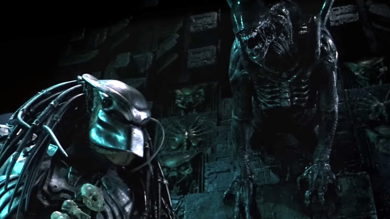 Xenomorph lurking over the Predator in Alien vs. Predator