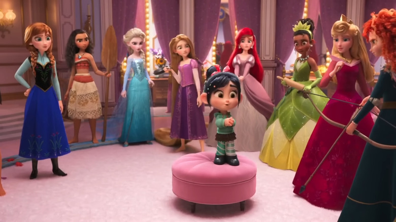 Sarah Silverman's Vanellope von Schweetz standing in the middle of the Disney Princesses in Ralph Breaks the Internet