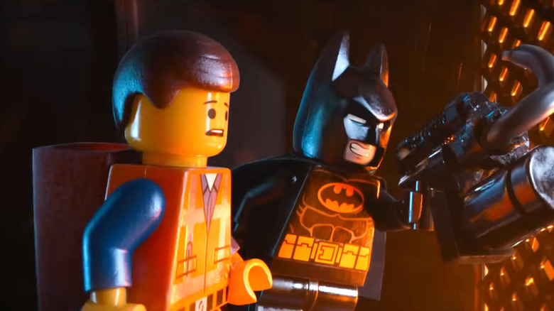 Chris Pratt's Emmet Brickowski standing next to Will Arnett's Batman in The LEGO Movie