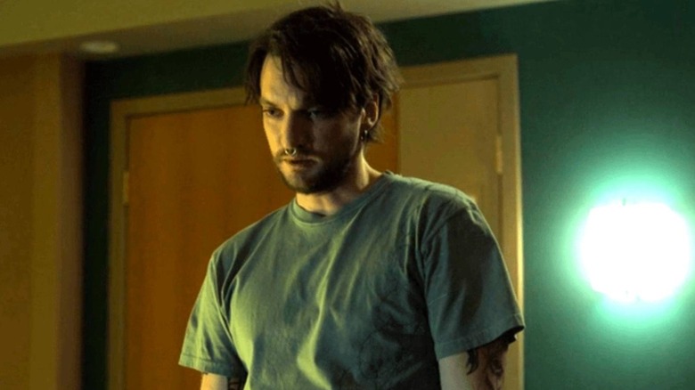 Erik looks pensive while at the hospital in "Final Destination Bloodlines" (2025)