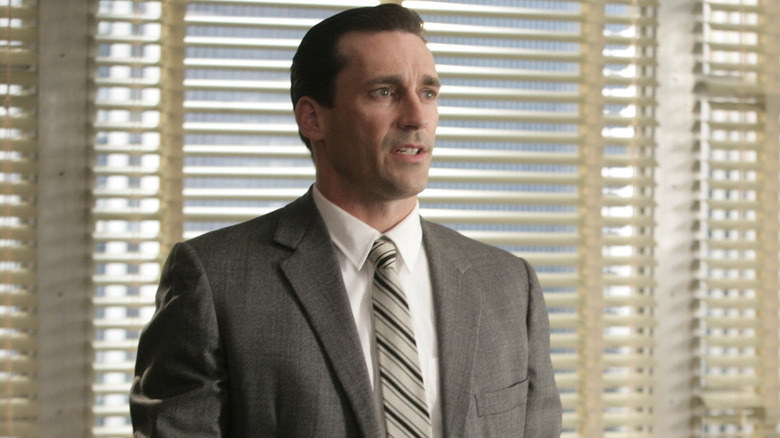 Don standing in front of a window in Mad Men (2007)