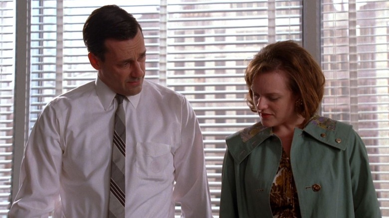 Peggy showing something to Don in Mad Men (2007)