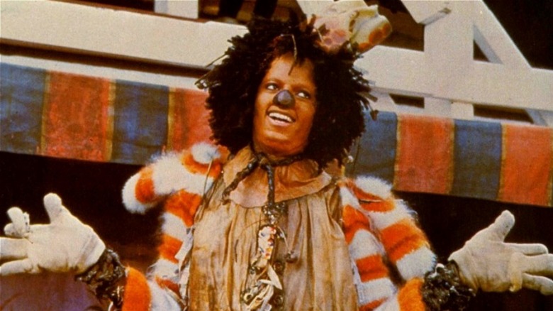 Scarecrow holding his arms out wide in The Wiz (1978)