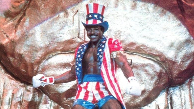 Apollo Creed smiling with Uncle Sam outfit in "Rocky IV"