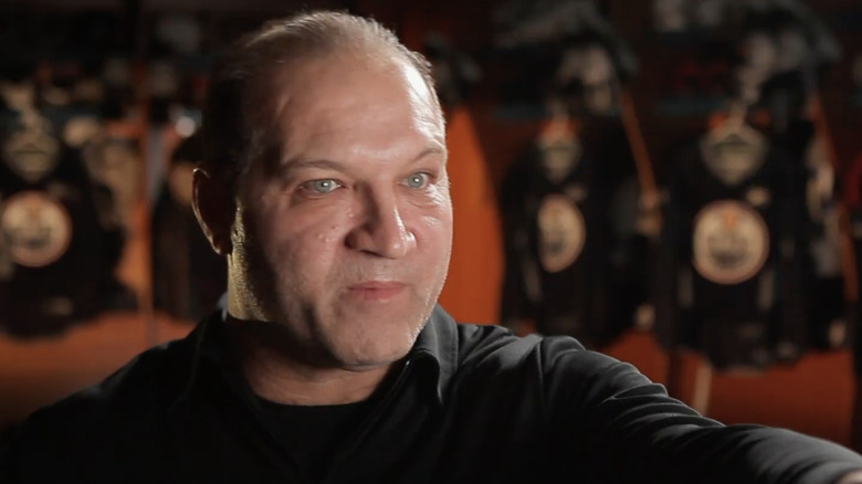 Dave Semenko in Edmonton Oilers locker room demonstrating fighting technique