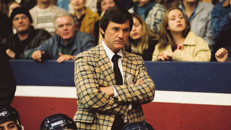 Coach Herb Brooks watching hockey game seriously in 