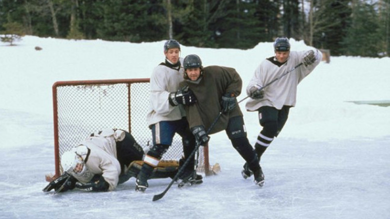 Mystery, Alaska three teenagers playing hockey on frozen pond