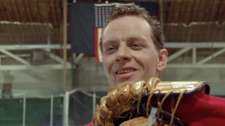 Net Worth movie Ted Lindsay smiling with chin on leather glove