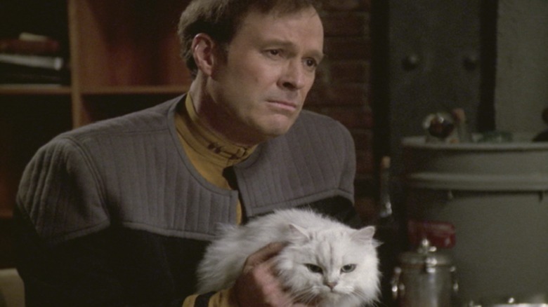 Reginald Barclay holding his cat in "Star Trek: Voyager"